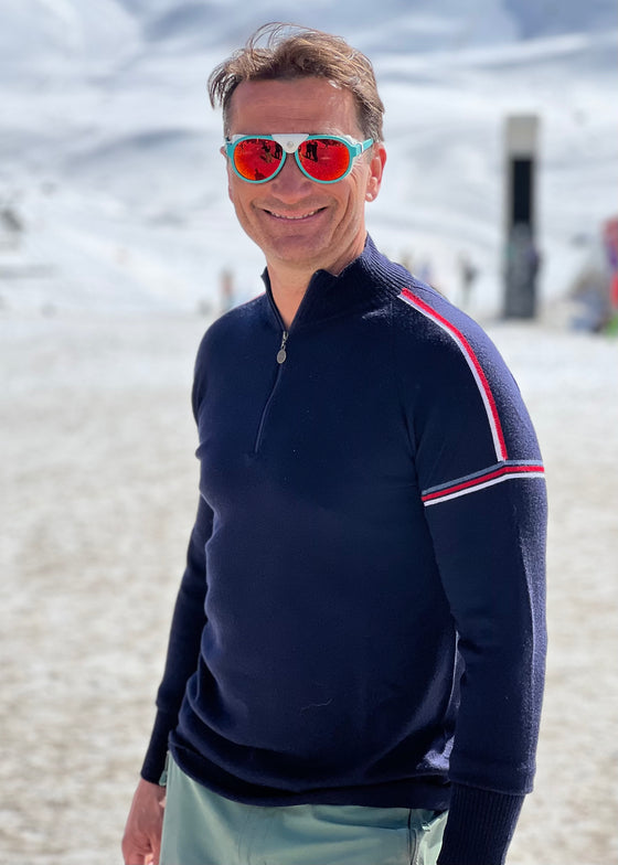 Graham Bell wears Snow Finel Ski Jumper. Navy with shoulder stripes